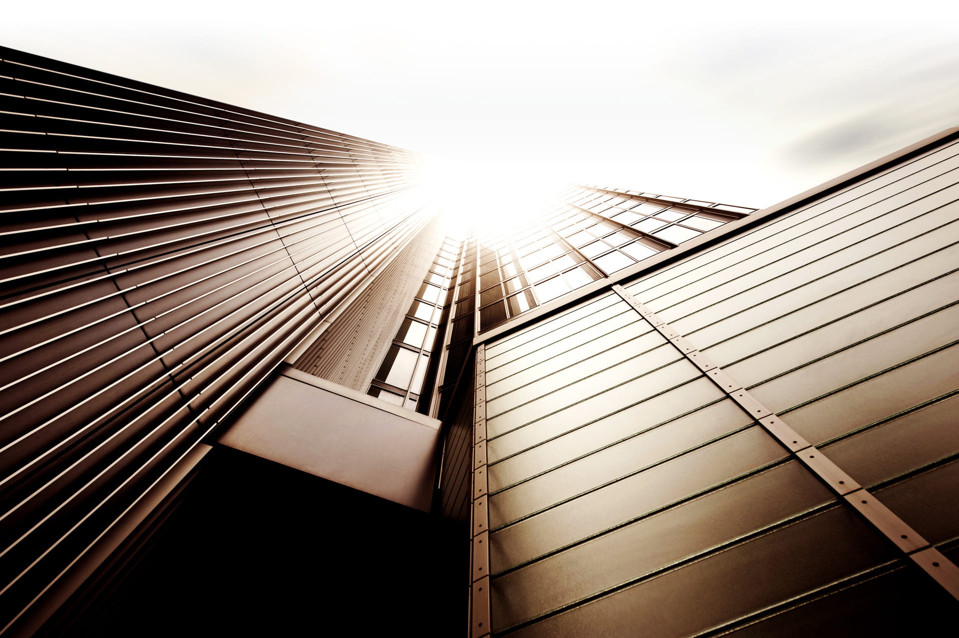 Bright sunlight reflects off building