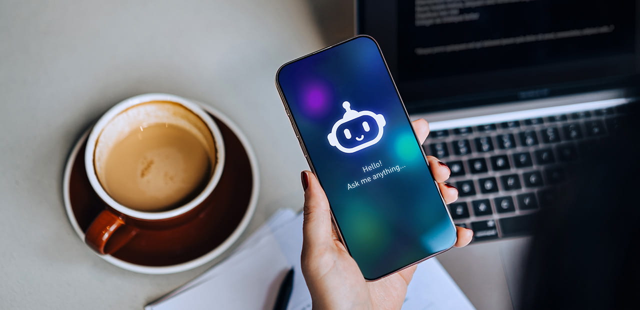 Business owner using an AI assistant on a smartphone, representing responsible AI use and governance.
